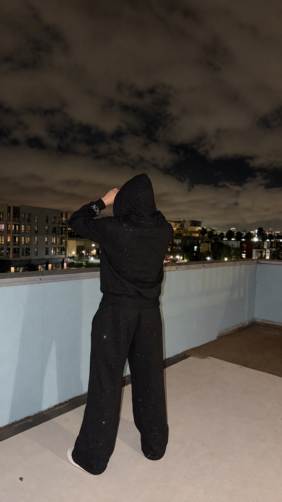 Back view of black M&N Orgullo rhinestone sweatpants