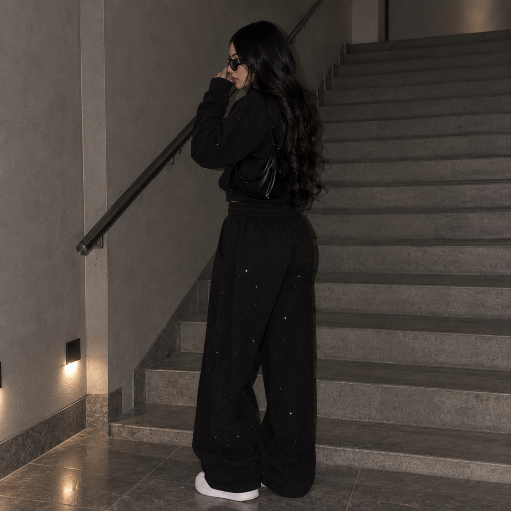 Back view of model wearing M&N Orgullo black rhinestone zip-up hoodie