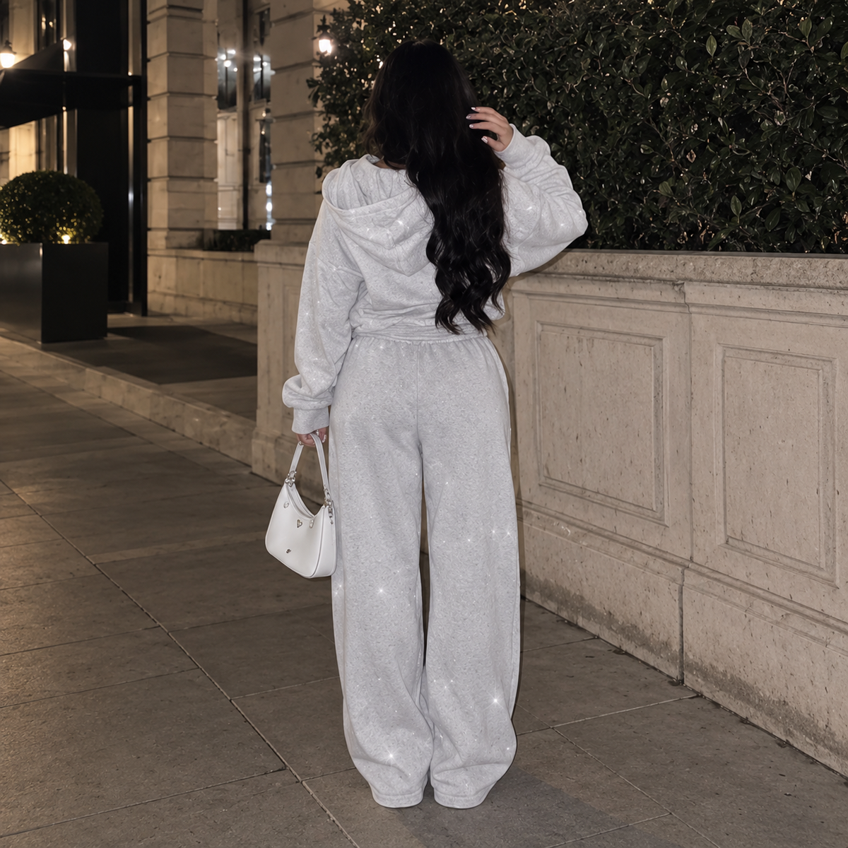 Back view of model wearing M&N Orgullo gray rhinestone hoodie