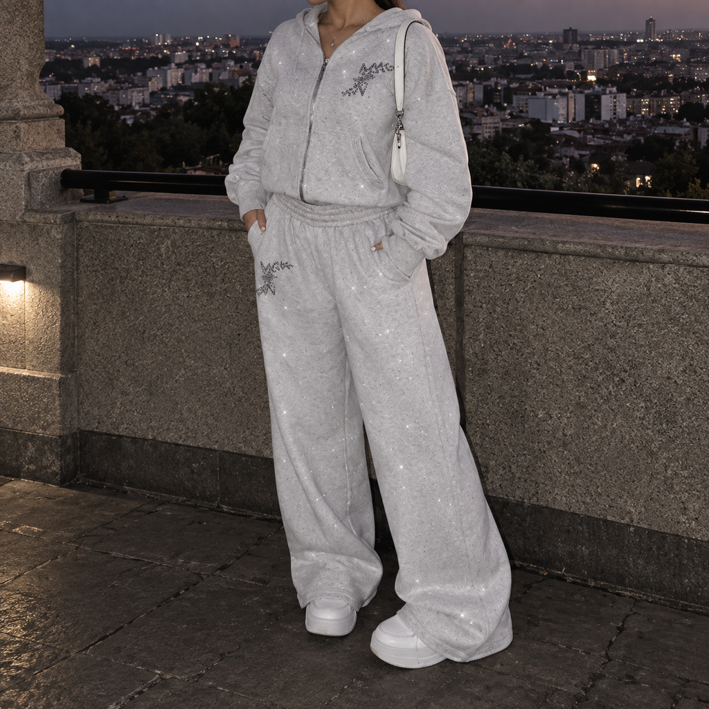Model wearing M&N Orgullo gray rhinestone sweatpants with matching hoodie
