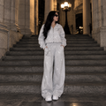 Model wearing M&N Orgullo gray rhinestone wide-leg sweatpants