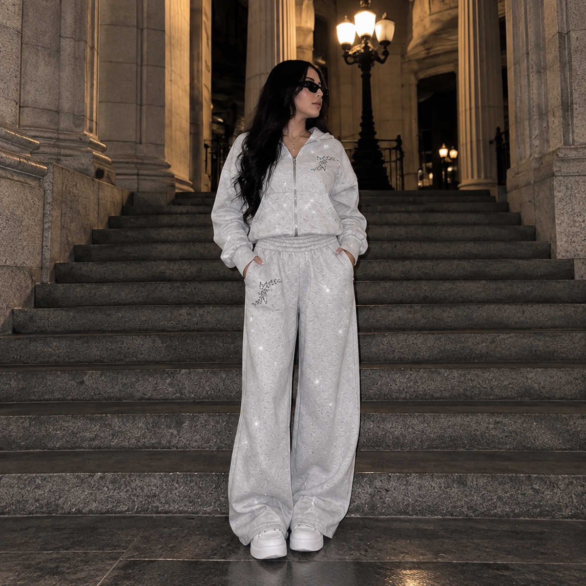 Model wearing M&N Orgullo gray rhinestone wide-leg sweatpants